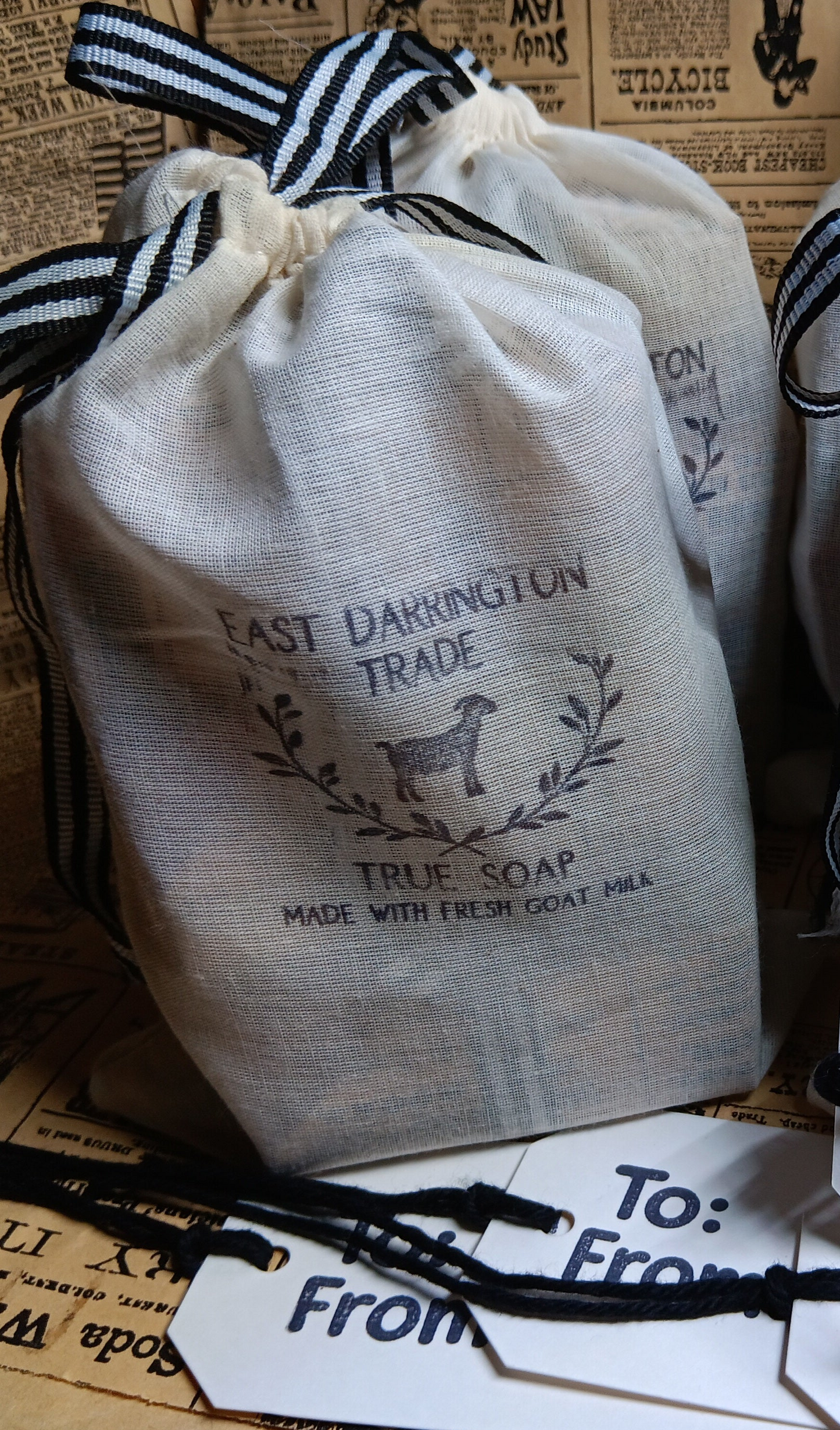 Goat milk soaps in cloth bas stamped with East Darrington Trade Logo gift tags 
